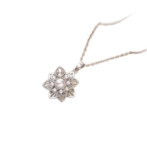 Elegant floral pendant necklace with a large center pearl and white zircon petal accents