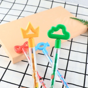 Detail of colorful plastic push pencils with cartoon crown and fruit patterns