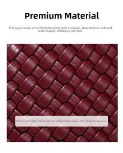 Macro shot of the deep wine red hand-woven leather texture on this luxury crescent bag