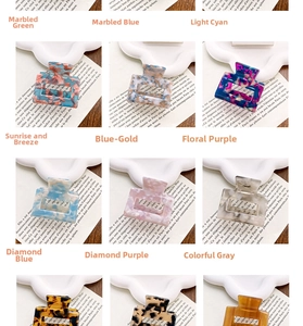 Detail view of assorted square acetate hair claws featuring various textures and patterns
