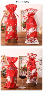 Detailed view of Christmas wine bottle bags with Santa and elk patterns and silk drawstrings