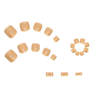 Nude pink glossy press-on toenails set in various sizes on a clean white background