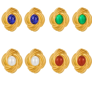Vintage gold stud earrings set with colorful pearls and turquoise on white background
