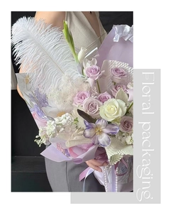 Close-up of white ostrich feathers used for luxury floral bouquet DIY arrangement