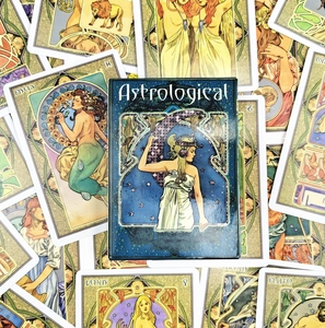 Macro shot of Astrological oracle cards with Art Nouveau illustrations on cards and box