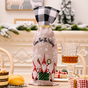 Christmas gnome wine bottle cover in burlap linen with red plaid trim and gnome print