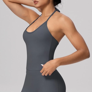 Detail of grey halter neck sports bra with high elastic fabric and thin straps