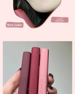 Detailed close-up showing matte velvet lipstick textures and three distinct red lip shades