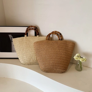 French style woven straw tote bags with bamboo handles in beige and brown colors