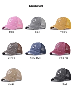 Multiple colors of distressed washed denim baseball caps with heart embroidery