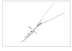 Detailed view of silver stainless steel cross pendant featuring engraved Faith text