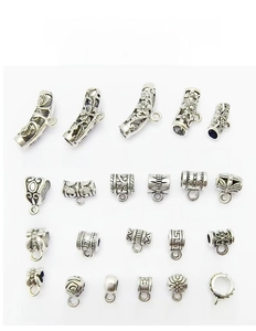 Detailed grid of 22 antique silver alloy tube beads and connectors with tribal carvings