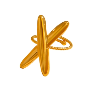 Detailed close-up of golden crossover X-shaped ring with textured beaded band detail