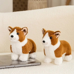 Cute realistic Corgi plush toy set with fluffy brown and white fur on laptop background