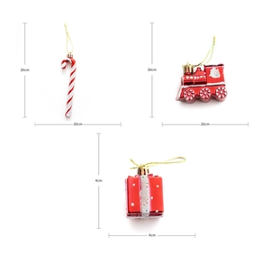 Detail of red and white candy cane, train and gift box ornaments with 20cm size marks