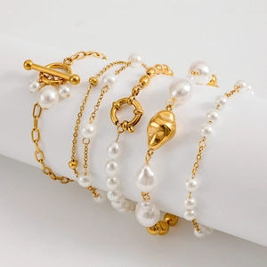 Detail view of gold-plated stainless steel chains with pearls and OT toggle clasps