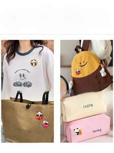Detailed application view of cute panda enamel pins on backpacks and clothing accessories
