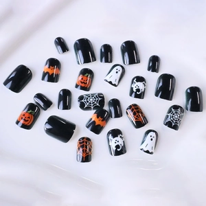 Short square Halloween press-on nails featuring pumpkin, ghost, and spider web designs