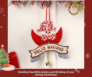 Detail of Christmas snowman ornament with Feliz Navidad sign and a golden bell