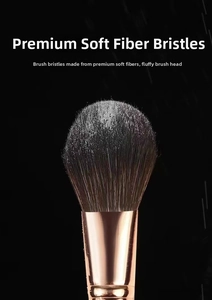 Close-up of soft fiber bristles and gold ferrule on a professional makeup brush