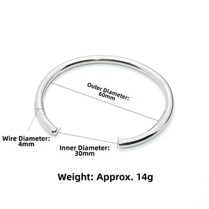 Detail view of silver wavy bangle with dimensions: 60mm diameter and 4mm thickness