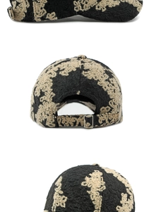 Detail of vintage jacquard baseball cap showing ethnic pattern and adjustable metal buckle