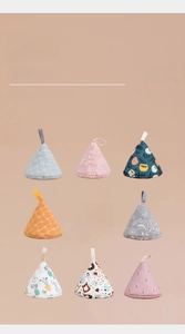 Macro detail of various patterned cotton pot lid covers with thick heat-resistant lining