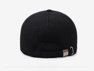 Detail view of winter baseball cap back with knitted texture and adjustable metal buckle