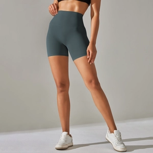 Detailed view of high waisted seamless yoga shorts with peach hip lifting effect in dark gray