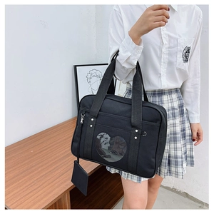 Detail of black Japanese JK uniform tote bag featuring a heart-shaped clear window