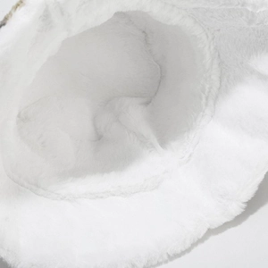 Close-up of the soft white faux fur texture and thick plush material of the bucket hat