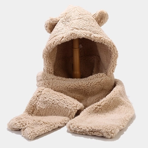 Close-up of beige fleece hat and scarf set with cute bear ears on wooden stand