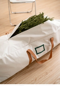 Detail of beige Oxford storage bag for Christmas trees with handles and card slot