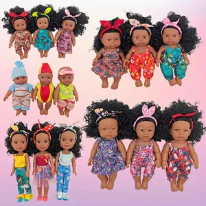 Collection of African vinyl baby dolls featuring diverse hairstyles and floral outfits