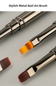 Macro detail of professional nail art brushes with gunmetal metal handles and gradient bristles