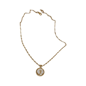 French style gold tulip flower coin necklace with twisted chain on white background
