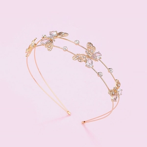 Detailed view of golden hollow butterfly headband with sparkling zircon crystals