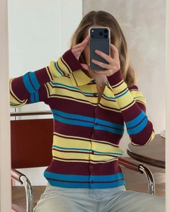 Macro detail of retro colorful striped knit cardigan with polo collar and button closure