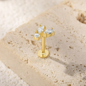 Detailed macro view of gold plated S925 silver butterfly labret with sparkling zircons