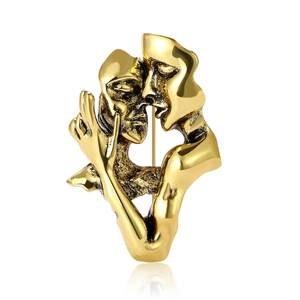 Artistic gold-colored vintage brooch featuring two lovers kissing on a white background