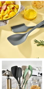 Close-up of heat-resistant silicone spatulas and brushes in various kitchen colors