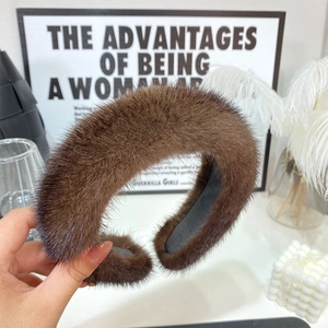 Close-up of soft brown faux fur headband with fluffy texture on a stylish vanity