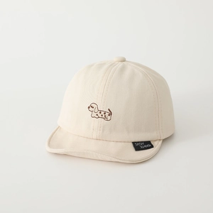 Close-up of cute dog embroidery and woven tag on this beige baby soft-brim baseball cap