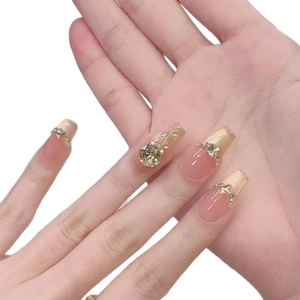 Classic French cat-eye press-on nails with champagne gold gradient and floral rhinestones