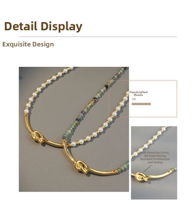 Close-up of 18k gold plated beaded necklace featuring natural stones and a 5cm extender