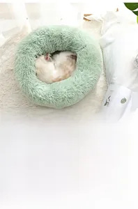 Detailed view of plush light green doughnut pet bed with extra thick soft filling