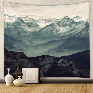 Detail of mountain wall tapestry in navy blue tones hanging on a minimalist grey wall