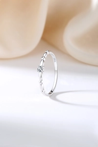 Macro shot of S925 sterling silver ring featuring a small round zircon and inner hallmark