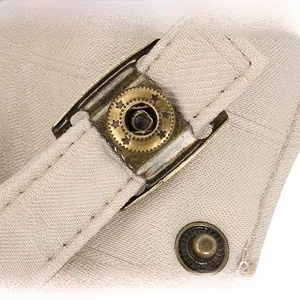 Detail of canvas flat cap with adjustable vintage bronze buckle and star engraving