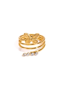 Macro view of golden multi-layer spiral ring featuring butterfly detail and clear zircons